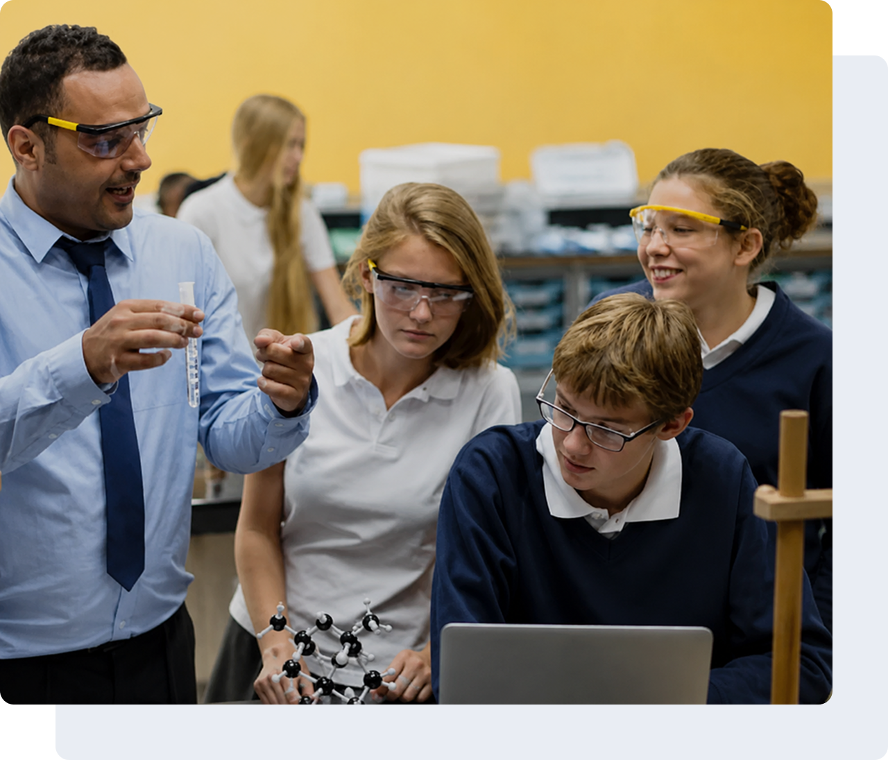 Science teacher demonstrating experiment to students.
