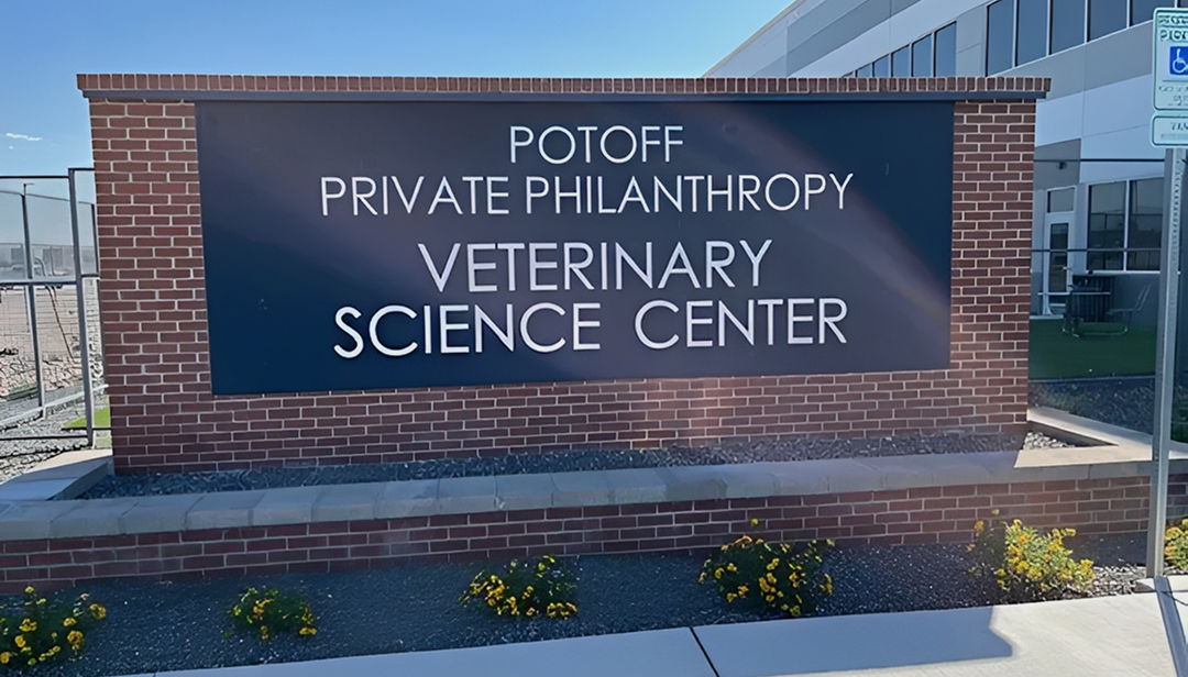 Veterinary Science Center sign on brick wall.